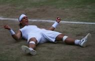 LONDON - JULY 06: Rafael Nadal of Spain celebrates winning match point and the Championship during the men's singles Final match against Roger Federer of Switzerland on day thirteen of the Wimbledon Lawn Tennis Championships at the All England Lawn Tennis and Croquet Club on July 6, 2008 in London, England. (Photo by Julian Finney/Getty Images)
